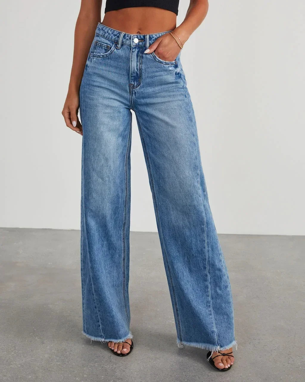 Loose fit jeans met rafelzoom Dames