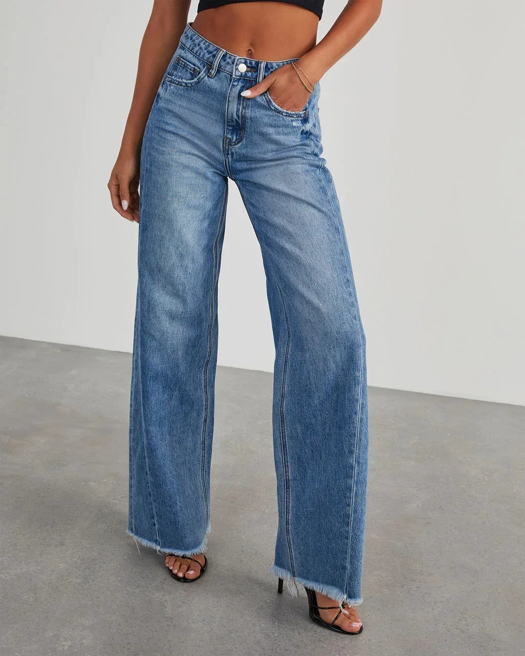Loose fit jeans met rafelzoom Dames